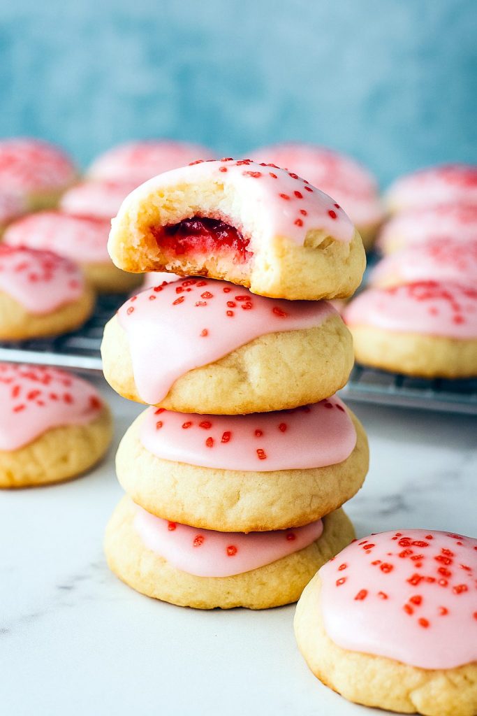 A close-up of soft Cherry Cookies studded with maraschino cherries, showcasing Almond Meal Cookies with a light crinkle texture, ideal for any Cherry Cookies Recipes spread.