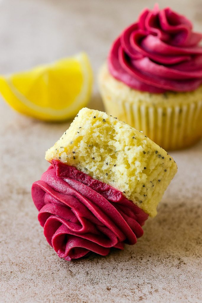 A golden Cupcake speckled with poppy seeds and crowned with deep purple blackberry buttercream—pure Yummy Food Dessert magic. This festive scene showcases one of the best Cupcake Recipes, a must-try for lovers of Just Desserts.