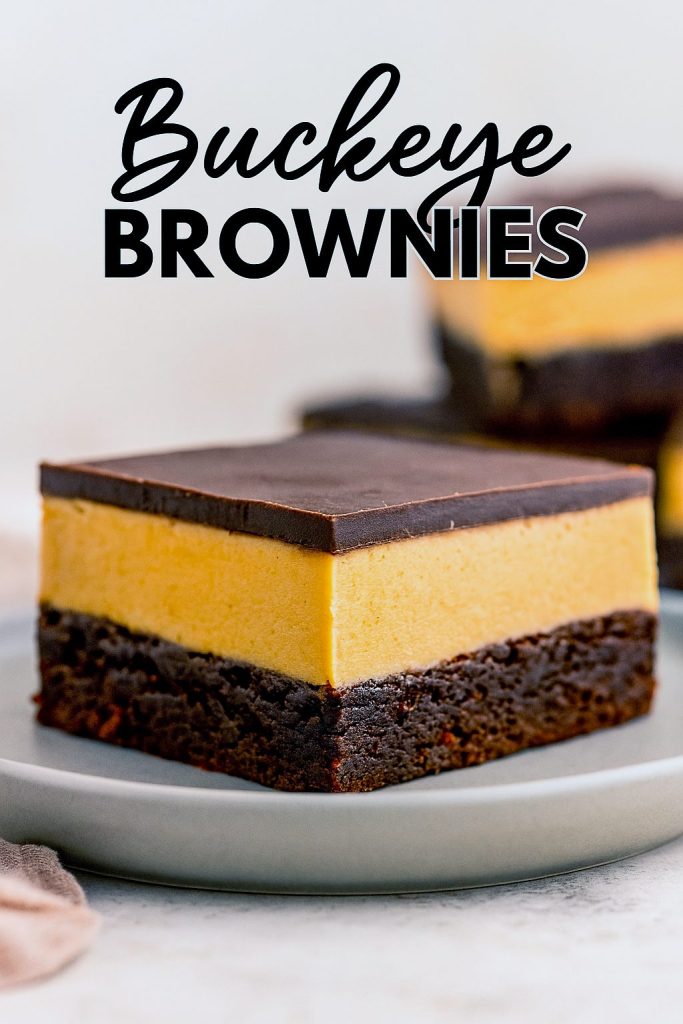 Close-up of Buckeye Brownies With Peanut Butter Frosting showcasing a stack of rich Buckeye Brownies with a sprinkle of pretzel pieces hinting at an Easy Peanut Butter Buckeye Recipe With Pretzels.