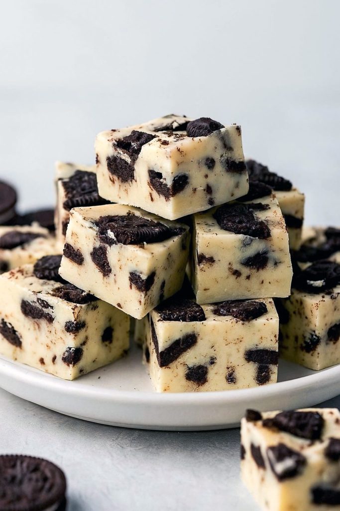 Plate of creamy Oreo fudge squares illustrating How To Make Soft Fudge, part of festive No Bake Christmas Fudge and Fudge Dessert Recipes, showing the silky finish of How To Make White Fudge, a fail-safe alternative to a Dry Fudge Recipe, and featured among favorite Candy Fudge Recipes, hailed as the Best Ever Fudge Recipe and one of the Good Fudge Recipes, ideal for your Christmas Sweets To Make list.