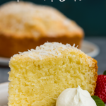A golden, dense coconut cream cheese pound cake loaf dusted with powdered sugar, served on a rustic wooden board with fresh berries—showcasing a classic Coconut Cake Recipe, perfect as Coconut Desserts, Loaf Cake, Dessert Aux Fruits, Monkey Bread inspiration, and top Köstliche Desserts and Coconut Pound Cakes in any Coconut Recipes collection.
