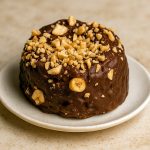 A stack of golden-brown Cookies For Parties coated in glossy chocolate and feuilletine flakes, evoking the cozy crunch of Chocolate Toast.
