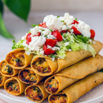 A stack of perfectly fried taquitos filled with creamy chicken and cheese, served alongside a small bowl of salsa for Dip, showcasing a mouthwatering Taquitos Recipe that’s ideal for Appetizer Snacks or Health Dinner Recipes and part of easy Chicken Dishes Recipes and Appetizer Recipes.
