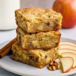 A freshly sliced Best Apple Brownies bar studded with apple chunks and pecans, illustrating the ultimate Chocolate Apple Desserts, Apple Pecan Dessert, and Classic Thanksgiving Desserts vibe—this Apple Brownies Recipe doubles as Apple Pie Blondies, ideal Fall Dessert Bars, straight from your favorite Recipes Apples collection of Simple Apple Desserts.