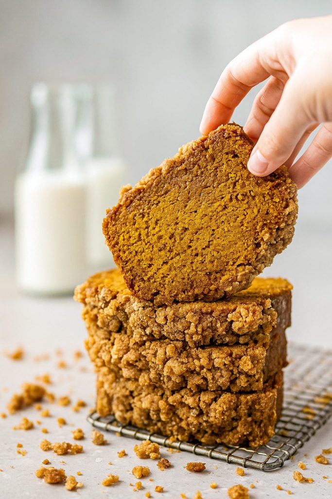 Close-up of a golden loaf of Pumpkin Strudel Bread with a generous Pumpkin Bread Topping, showcasing a Pumpkin Bread With Streusel twist on the classic Pumpkin Strudel.