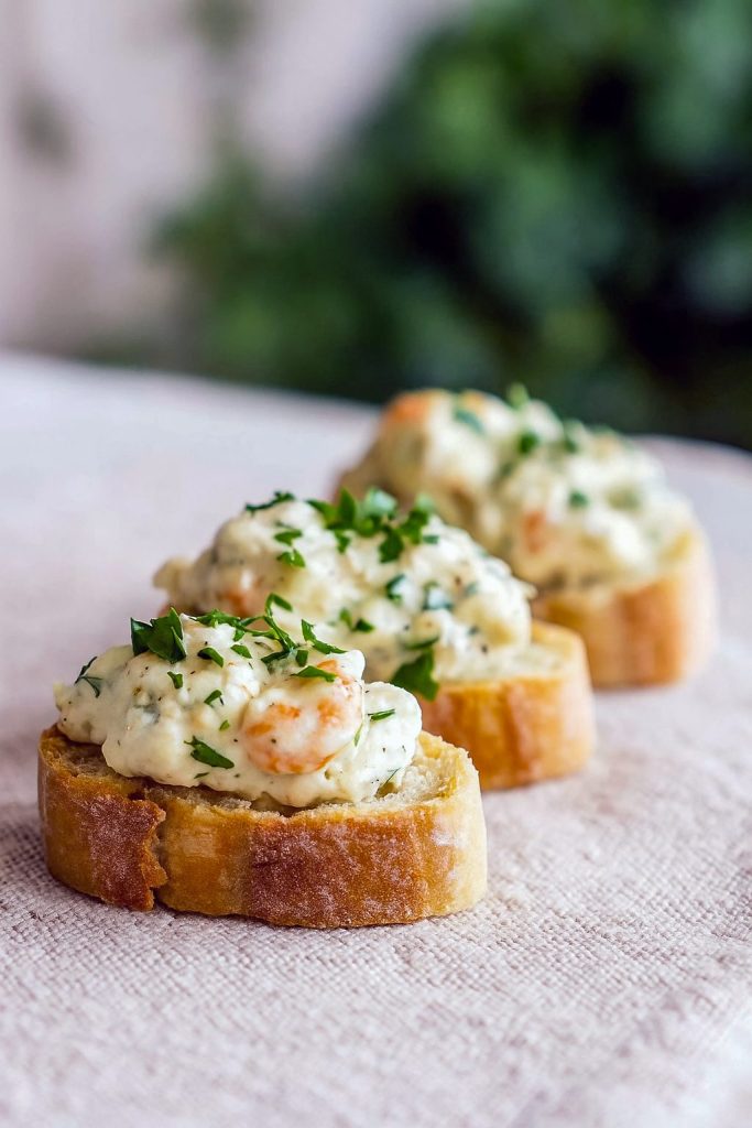 Cajun Shrimp Crostini topped with creamy crab spread on toasted baguette, a perfect springtime seafood appetizer and favorite party appetizer.