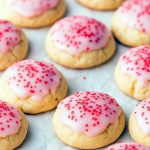 A close-up of soft Cherry Cookies studded with maraschino cherries, showcasing Almond Meal Cookies with a light crinkle texture, ideal for any Cherry Cookies Recipes spread.