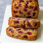 Golden loaf of Fruit Bread bursting with raspberries, reminiscent of Cloud Bread lightness, perfect for Raspberry Desserts fans.