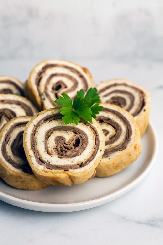 Close-up of sliced Roast Beef Roll Ups Appetizers made with soft tortillas, creamy horseradish spread, and deli roast beef — perfect Appetizer Bites Finger Foods Cold for parties and easy Roast Beef Pinwheel Appetizers.