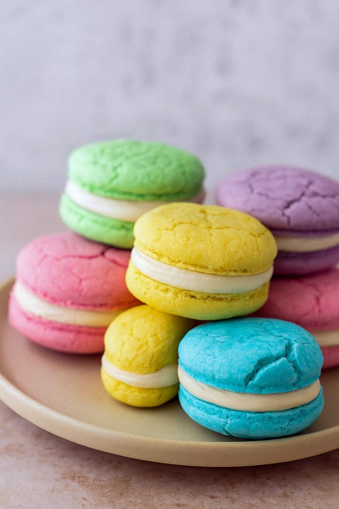 Pastel-colored Sugar Cookie Sandwich with creamy vanilla filling, perfect Soft And Fluffy Sugar Cookies for spring or Mother’s Day Treats Idea, inspired by Homemade Wafer Cookies and topped with sweet Sugar Cookie Recipe Icing.